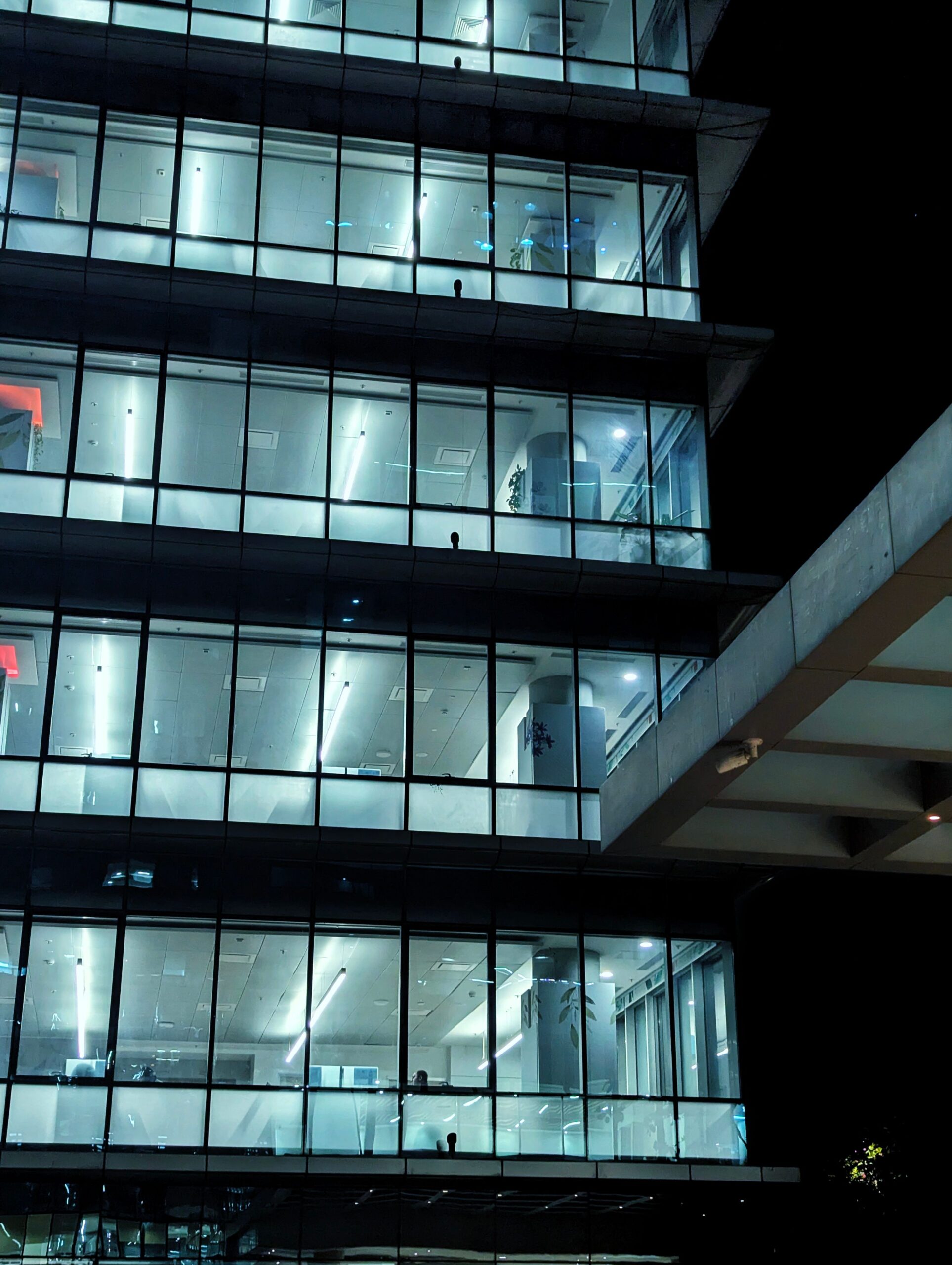 Home View of a sleek and illuminated modern office building at night showcasing urban architecture in Mumbai, India.
